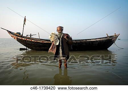 Pilgrims bathing at the confluence of the river Ganges and the Bay of Bengal, Sagar Mela, India, Ganges River. View Large Photo Image Stock Image - Pilgrims bathing at the confluence of the river Ganges and the Bay of Bengal, Sagar Mela, India, Ganges River.. Fotosearch