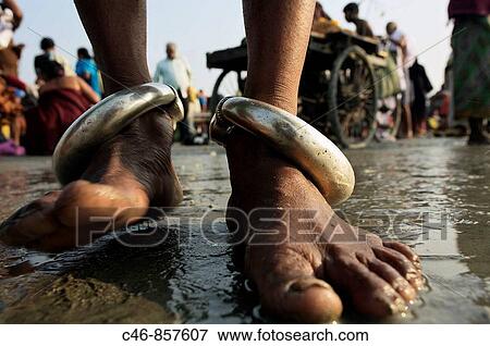 Pilgrims bathing at the confluence of the river Ganges and the Bay of Bengal. Sagar Mela. Ganges River. India. View Large Photo Image Stock Photo - Pilgrims bathing at the confluence of the river Ganges and the Bay of Bengal. Sagar Mela. Ganges River. India.. Fotosearch