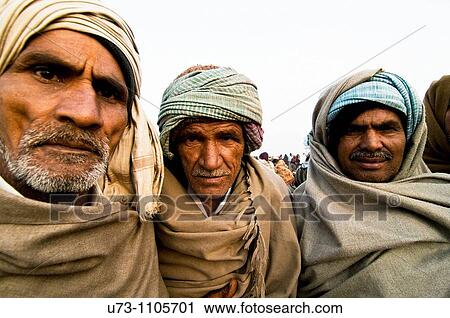 Stock Image - Pilgrims on Gangasagar island, India.. Fotosearch