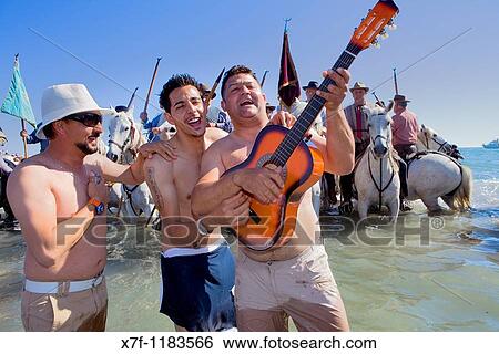 Pilgrims singing Blessing at sea Procession during annual gipsy pilgrimage at Les Saintes Maries de la Mer may, Camargue, Bouches du Rhone, France View Large Photo Image Stock Photograph - Pilgrims singing Blessing at sea Procession during annual gipsy pilgrimage at Les Saintes Maries de la Mer may, Camargue, Bouches du Rhone, France. Fotosearch