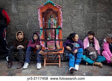 Pilgrims sit by an image of the Virgin of Guadalupe at the pilgrimage to Our Lady of Guadalupe Basilica in Mexico City, Mexico, December 10, 2013. View Large Photo Image Stock Photo - Pilgrims sit by an image of the Virgin of Guadalupe at the pilgrimage to Our Lady of Guadalupe Basilica in Mexico City, Mexico, December 10, 2013.. Fotosearch