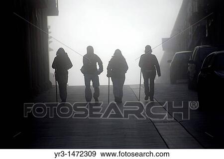 Pilgrims walk through the early morning fog in Portomarin town, Galicia region, in the French Way that leads to Santiago de Compostela, Spain. View Large Photo Image Stock Photo - Pilgrims walk through the early morning fog in Portomarin town, Galicia region, in the French Way that leads to Santiago de Compostela, Spain.. Fotosearch