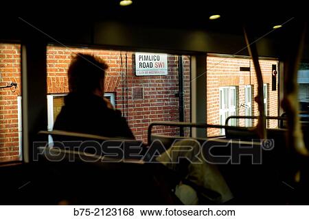 Pimplico Road, SW1, City of Westminster, street name on the facade of a building view from a bus window with a close up silhouette of a unrecognizable man in London, England, UK, Europe. View Large Photo Image Stock Photo - Pimplico Road, SW1, City of Westminster, street name on the facade of a building view from a bus window with a close up silhouette of a unrecognizable man in London, England, UK, Europe.. Fotosearch