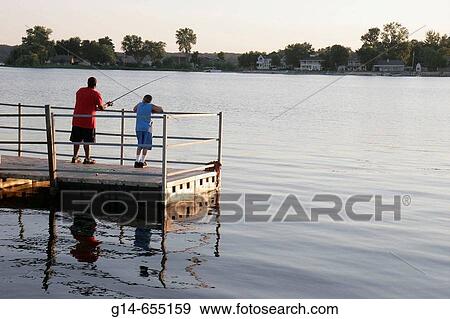 Stock Photo - Pine Lake, fishing pier, Black Hispanic boys. La Porte. Indiana. USA.. Fotosearch