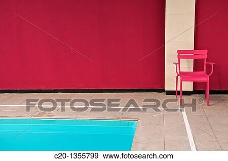 Pink metal chair and blue water of indoor swimming pool Best Western Hotel Reims Marne 51 France View Large Photo Image Stock Photo - Pink metal chair and blue water of indoor swimming pool Best Western Hotel Reims Marne 51 France. Fotosearch