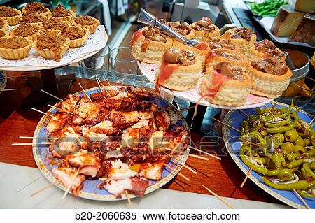 ? Pintxos? at Bar Txondorra in ol town, Donostia (San Sebastian), Gipuzkoa, Basque Country, Spain View Large Photo Image Stock Photography - ? Pintxos? at Bar Txondorra in ol town, Donostia (San Sebastian), Gipuzkoa, Basque Country, Spain. Fotosearch