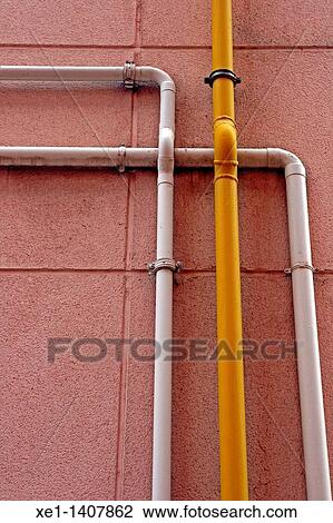 Stock Image - pipes in the wall, Terrassa, Catalonia, Spain.. Fotosearch