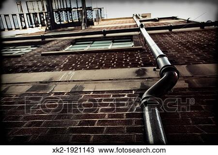 Pipes outside a house, brick's facade, Manchester, UK View Large Photo Image Stock Image - Pipes outside a house, brick's facade, Manchester, UK. Fotosearch