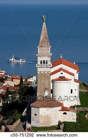 Stock Image - Piran, old town peninsula, italian style, St George's Church, Belfry, Baptistry, Gulf of Piran, Adriatic sea, Slovenia. Fotosearch