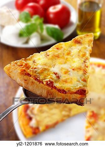 Pizza topped with 3 cheeses A Margarita Neopolitan Pizza View Large Photo Image Stock Photograph - Pizza topped with 3 cheeses A Margarita Neopolitan Pizza. Fotosearch