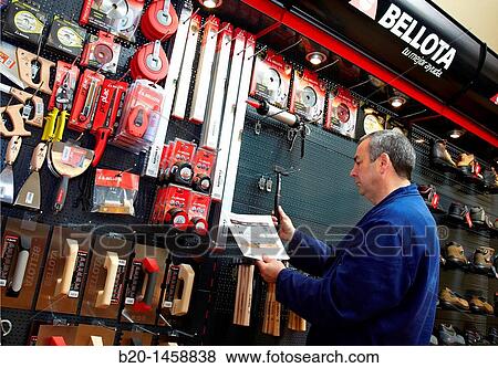 Stock Photo - Placing products in the path of consumers of a hardware store, merchandising, tools. Fotosearch