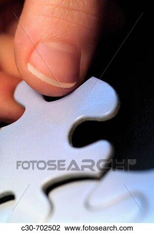Placing puzzle piece View Large Photo Image Stock Image - Placing puzzle piece. Fotosearch