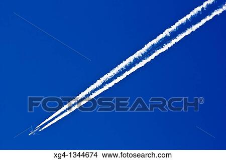 Plain and contrail View Large Photo Image Picture - Plain and contrail. Fotosearch
