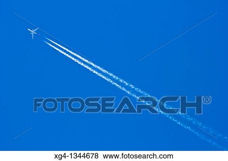 Stock Photo - Plain and contrail. Fotosearch