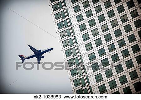 Plane about to crash against the most important skycraper building in Canary Wharf, London, UK View Large Photo Image Stock Image - Plane about to crash against the most important skycraper building in Canary Wharf, London, UK. Fotosearch