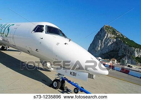Stock Photograph - Plane at Gibraltar airport. Fotosearch