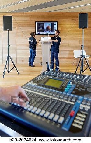 Plasma screen, lectern and sound equipment. Preparation audiovisual conference. Donostia. San Sebastian. Gipuzkoa. Basque Country. Spain. View Large Photo Image Picture - Plasma screen, lectern and sound equipment. Preparation audiovisual conference. Donostia. San Sebastian. Gipuzkoa. Basque Country. Spain.. Fotosearch