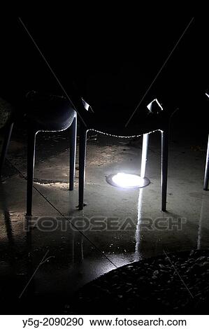 plastic chair in rain outdoors at night View Large Photo Image Stock Image - plastic chair in rain outdoors at night. Fotosearch