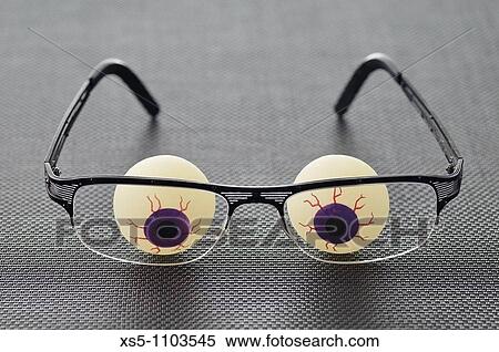 Stock Photography - plastic eyes and glass. Fotosearch