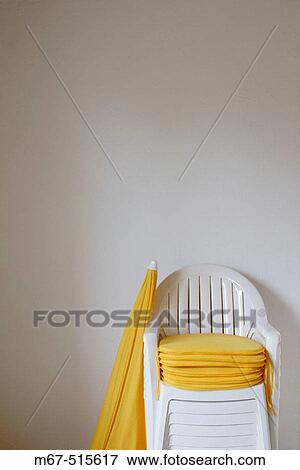 Plastic garden chairs and umbrella View Large Photo Image Stock Photo - Plastic garden chairs and umbrella. Fotosearch
