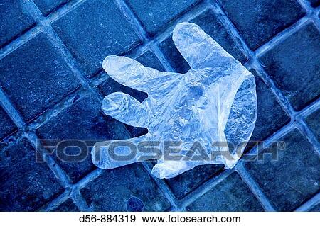 Stock Photo - plastic glove on the floor. Fotosearch