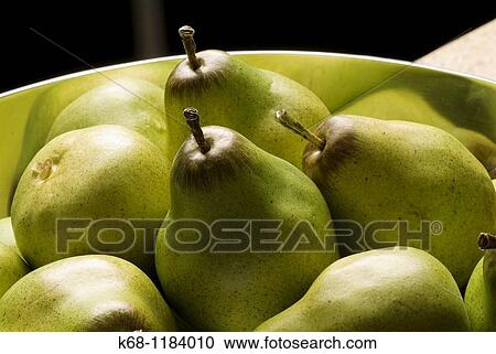 Stock Image - plastic pears in a bowl. Fotosearch