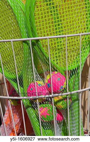 Stock Photo - Plastic Tennis Racket and balls for sale, Teignmouth, Devon, England. Fotosearch