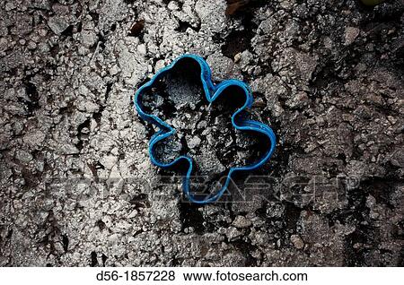 Stock Photo - plastic toy abandoned in the street, Valencia, Spain. Fotosearch
