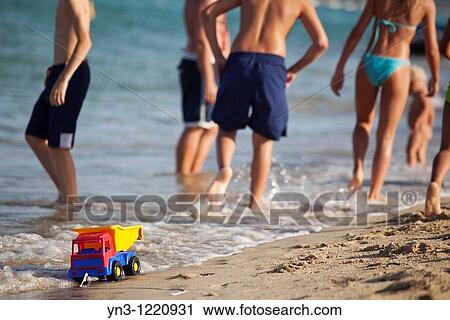 Plastic toy truck left on the sand View Large Photo Image Stock Image - Plastic toy truck left on the sand. Fotosearch