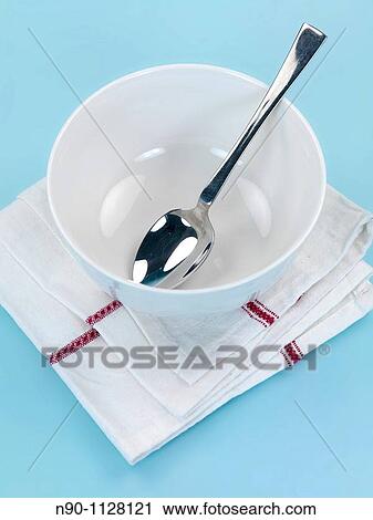 Plates and cutlery isolated against a blue background View Large Photo Image Stock Image - Plates and cutlery isolated against a blue background. Fotosearch