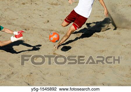 players in action at a beach soccer tournament View Large Photo Image Stock Image - players in action at a beach soccer tournament. Fotosearch