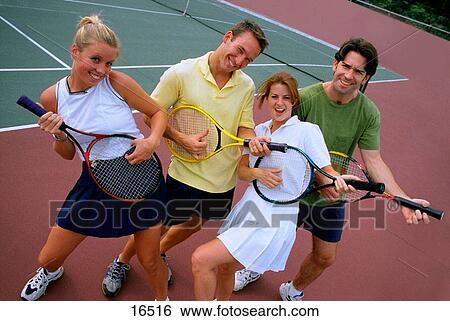 Players joking on tennis court View Large Photo Image Stock Photograph - Players joking on tennis court. Fotosearch