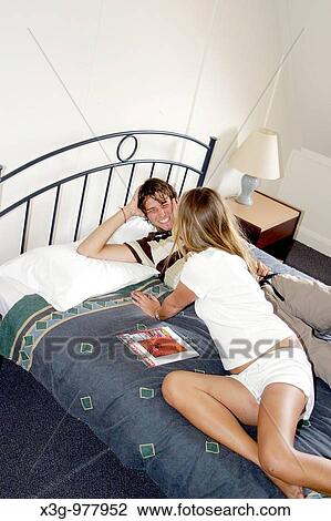 Playful backpackers in hotel room View Large Photo Image Stock Image - Playful backpackers in hotel room. Fotosearch