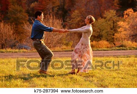 Playful couple in the country View Large Photo Image Picture - Playful couple in the country. Fotosearch