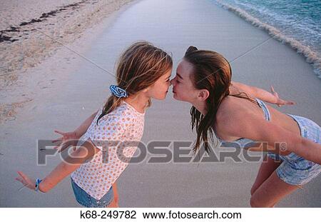 playful girls on beach View Large Photo Image Stock Image - playful girls on beach. Fotosearch