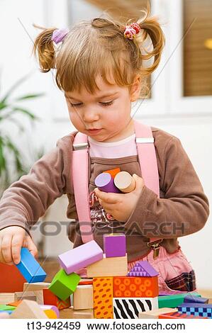 Playful toddler girl View Large Photo Image Stock Photo - Playful toddler girl. Fotosearch
