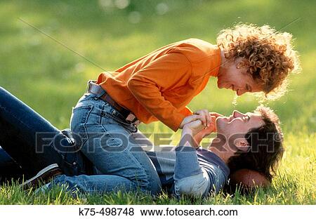 Playful young couple View Large Photo Image Stock Photo - Playful young couple. Fotosearch