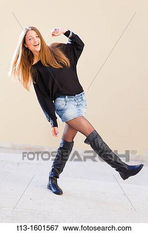 Playful young woman on the street View Large Photo Image Stock Photo - Playful young woman on the street. Fotosearch