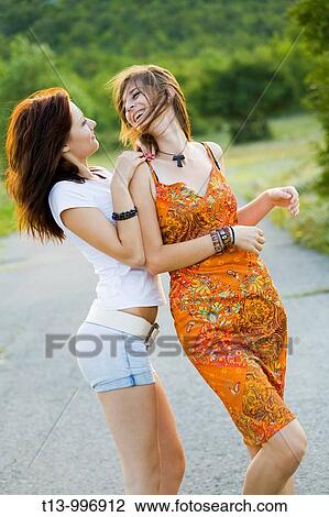 Stock Image - Playful young women. Fotosearch
