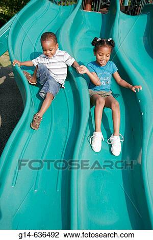 Playground slide, Black female, male. Dothan. Alabama. USA. View Large Photo Image Stock Image - Playground slide, Black female, male. Dothan. Alabama. USA.. Fotosearch