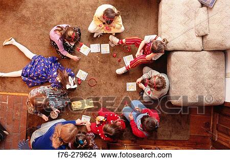 Picture - Playing bingo at 7th birthday party. Fotosearch