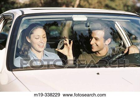 Stock Photo - playing CDs in a car. Fotosearch
