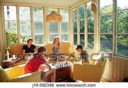 Playing chess, children and adults on the summer balcony. View Large Photo Image Stock Photo - Playing chess, children and adults on the summer balcony.. Fotosearch
