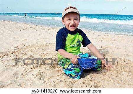 Playing in the sand at Flamenco beach on the island of Culebra, Puerto Rico View Large Photo Image Stock Image - Playing in the sand at Flamenco beach on the island of Culebra, Puerto Rico. Fotosearch