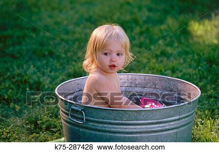 Playing in washtub View Large Photo Image Stock Photo - Playing in washtub. Fotosearch