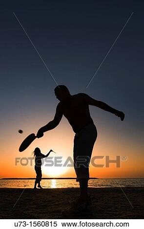 Playing? Matkot?, Israeli beach paddleball, on a beautiful afternoon on the beach of Tel-Aviv. View Large Photo Image Stock Photography - Playing? Matkot?, Israeli beach paddleball, on a beautiful afternoon on the beach of Tel-Aviv.. Fotosearch