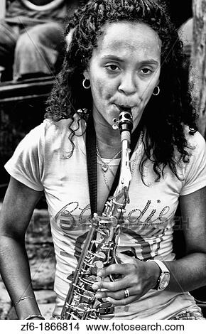 Picture - Playing music on the streets of Cienfurgos Cuba. Fotosearch