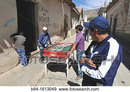 Playing table football. Tarabuco is a Bolivian town in the department of Chuquisaca, capital of the YamparBez Province and its first section, Tarabuco Municipality. View Large Photo Image Stock Photo - Playing table football. Tarabuco is a Bolivian town in the department of Chuquisaca, capital of the YamparBez Province and its first section, Tarabuco Municipality.. Fotosearch