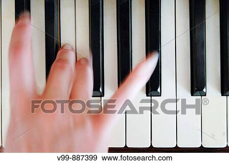 plays the piano View Large Photo Image Stock Photo - plays the piano. Fotosearch