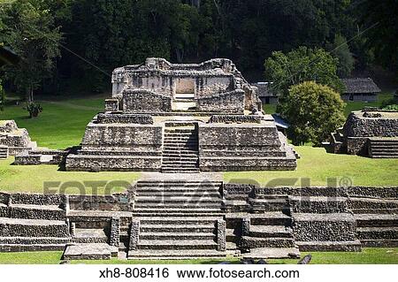 Stock Photograph - Plaza A, Structure A6 -Temple of the Wooden Lintel, one of the oldest buildings in Caracol-, Maya archaeological site, Belize. Fotosearch